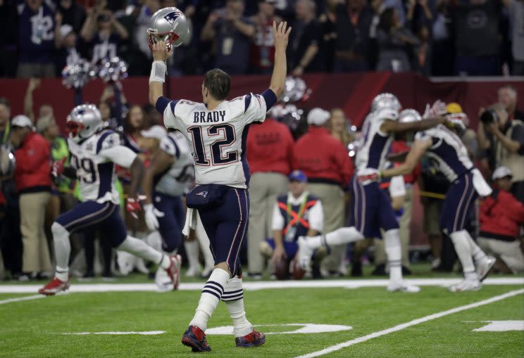 Tom Brady and the Patriots celebrate after winning Super Bowl LI in overtime. (AP)