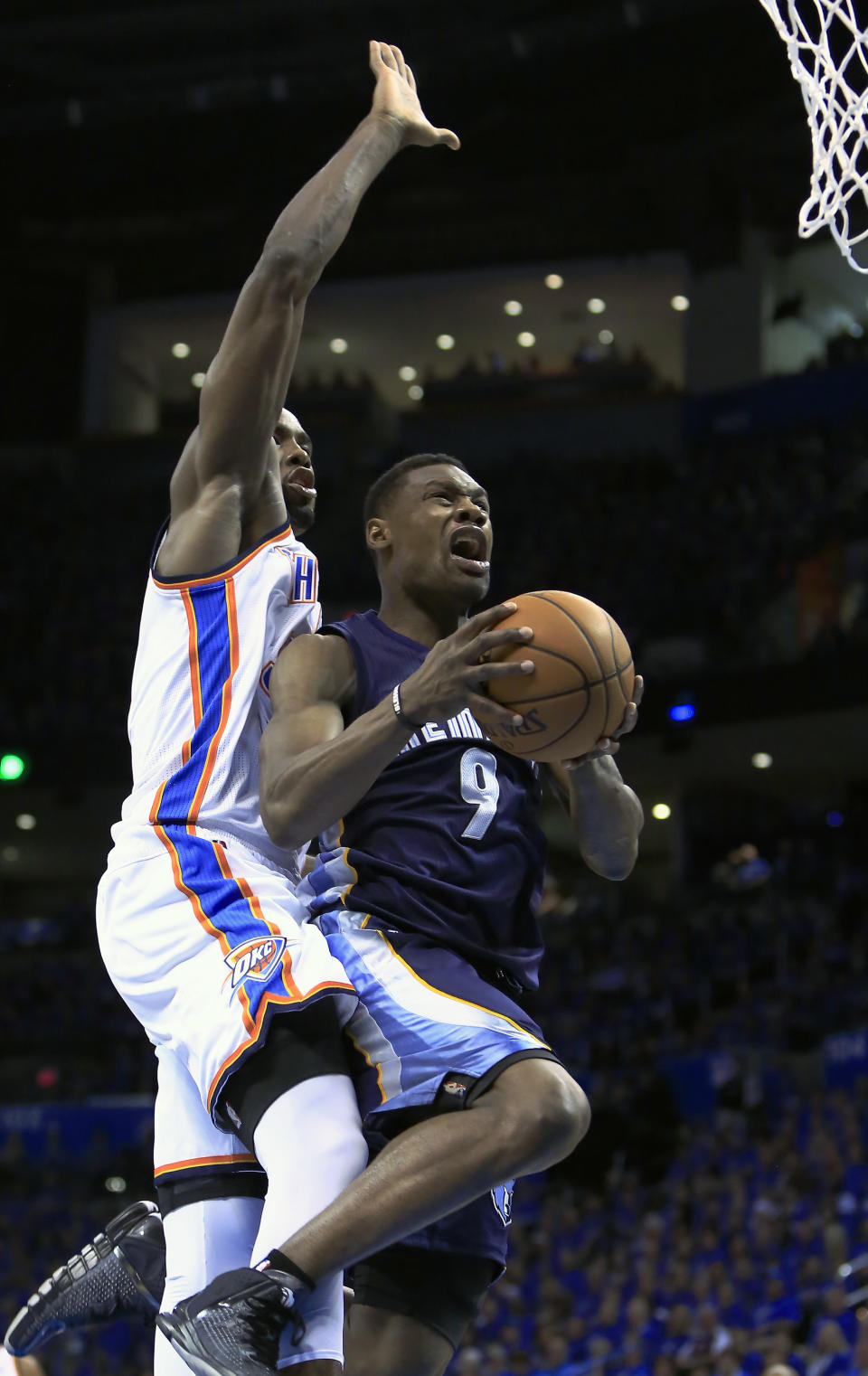 Memphis Grizzlies guard Tony Allen (9) goes to the basket in front of Oklahoma City Thunder forward Serge Ibaka (9) during the second quarter of Game 1 of the opening-round NBA basketball playoff series in Oklahoma City on Saturday, April 19, 2014. (AP Photo/Alonzo Adams)