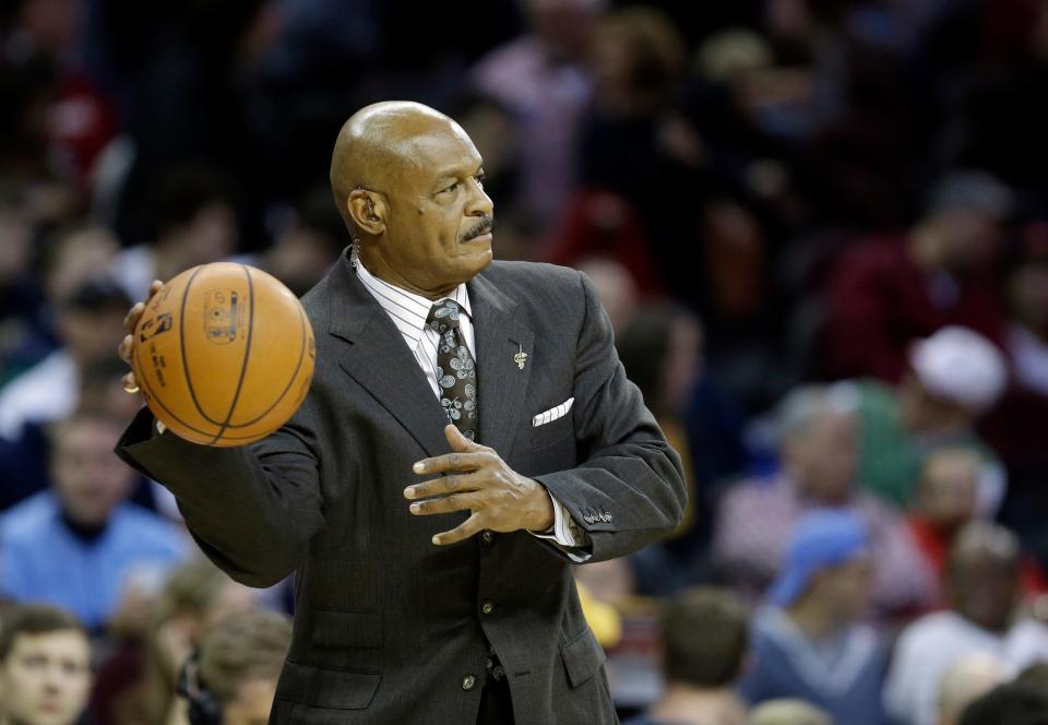 Broadcaster and former Cavaliers great Austin Carr throws a ball back onto the court before a game between the Minnesota Timberwolves and Cleveland on Dec. 23, 2014.