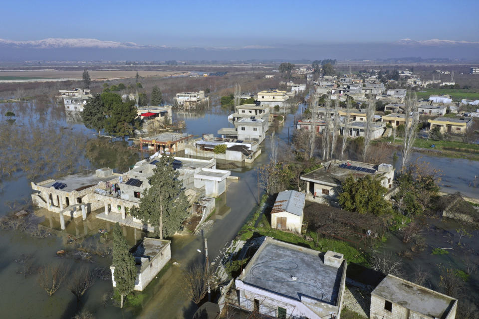 An aerial view of the al-Tlul village flooded after a devastating earthquake destroyed a river dam in the town of Salqeen near the Turkish border, Idlib province, Syria, Thursday, Feb. 9, 2023. (AP Photo/Ghaith Alsayed)