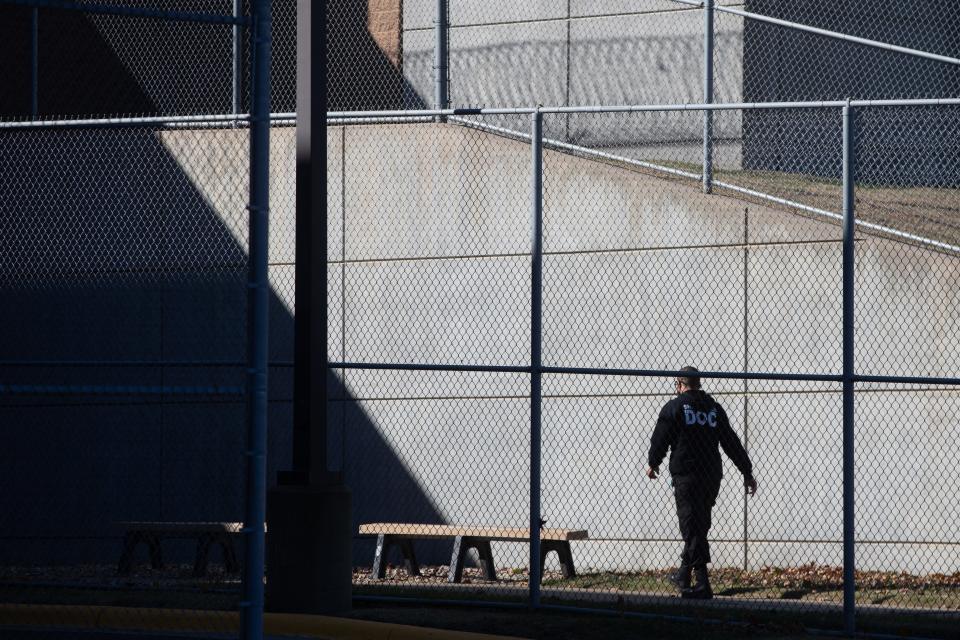 An employee of the Shawnee County Department of Corrections performs a routine check of the premises. County commissioners agreed last month to implement pay increases this month for positions seeing critical staffing shortages, including corrections specialists.