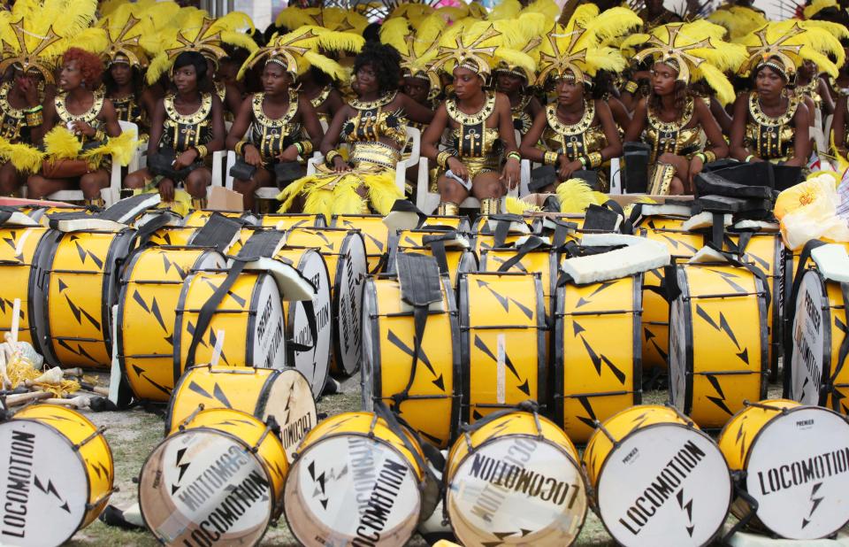 Performers sit near their drums before the start of Lagos Carnival in Lagos, Nigeria, Monday, April 1, 2013. Performers filled the streets of Lagos' islands Monday as part of the Lagos Carnival, a major festival in Nigeria's largest city during Easter weekend. (AP Photo/Sunday Alamba)