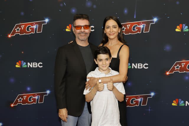 <p>Kevin Winter/Getty</p> Simon Cowell, Lauren Silverman and Eric Cowell at the 'America's Got Talent' season 18 finale in 2023.