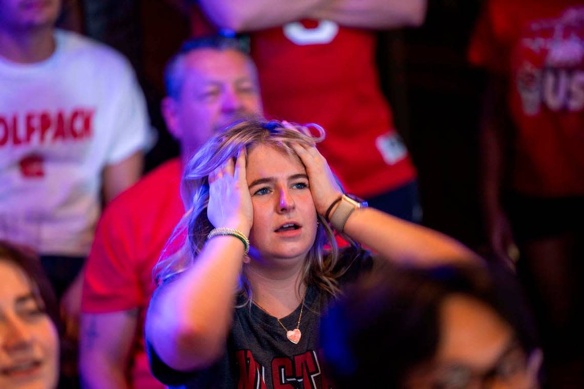 NC state fans at Players’ Retreat in Raleigh react as Duke takes an early lead against the Wolfpack lduring the first half of the Elite Eight round of the NCAA Men’s Division I Basketball Tournament on Sunday, March 31, 2024.