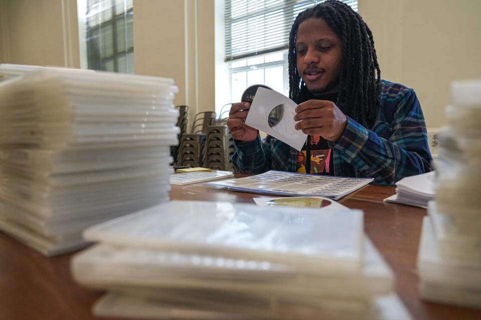 Blake Williams, part of the Alamo Drafthouse's Video Vortex crew, packs Spanish films from the Vulcan Video library into plastic sleeves. The Alamo will be making Vulcan titles available to rent at the Village later this year.