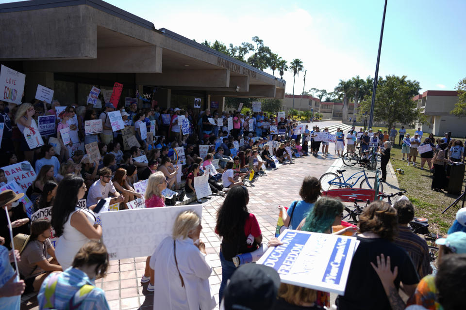 New College of Florida students and supporters protest ahead of a meeting by the college's board of trustees, Tuesday, Feb. 28, 2023, in Sarasota, Fla. The conservative-dominated board of trustees of Florida's public honors college was meeting Tuesday to take up a measure making wholesale changes in the school's diversity, equity and inclusion programs and offices. (AP Photo/Rebecca Blackwell)