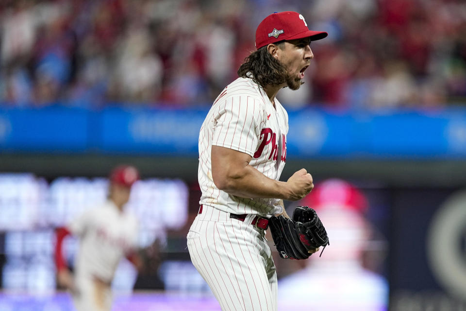 FILE - Philadelphia Phillies starting pitcher Michael Lorenzen celebrates a strike out against the Arizona Diamondbacks during the fifth inning in Game 6 of the baseball NL Championship Series in Philadelphia Monday, Oct. 23, 2023. Lorenzen signed a one-year contract and joined the Texas Rangers on Friday, March 22, 2024, giving the World Series champions another starting pitcher less than a week before the season opener. (AP Photo/Brynn Anderson, File)