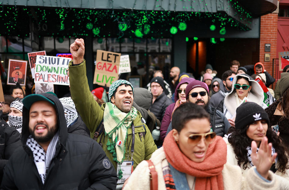 Indya Moore, front right, and Melissa Barrera, top right in green sunglasses, attend the pro-Palestine march hosted by Let Gaza Live on Jan. 21 in Park City, Utah.