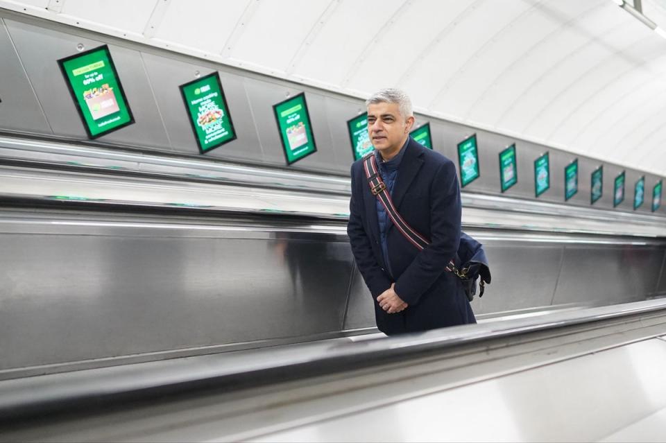 London Mayor Sadiq Khan travels on an escalator at Leicester Square underground station (PA)