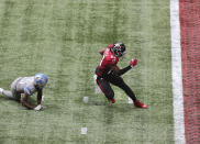 Atlanta Falcons running back Todd Gurley gets past Detroit Lions safety Will Harris before trying to stop short of the end zone to control the final minutes of the clock in the fourth quarter of an NFL football game Sunday, Oct. 25, 2020, in Atlanta. (Curtis Compton/Atlanta Journal-Constitution via AP)