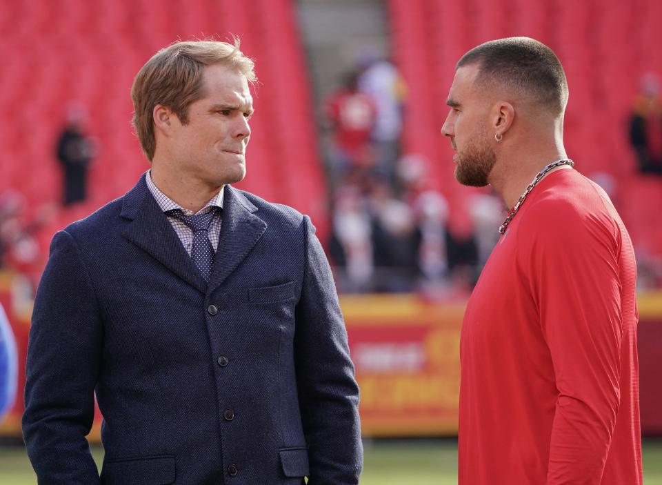 Greg Olsen talks to Kansas City Chiefs tight end Travis Kelce prior to a game in 2022.