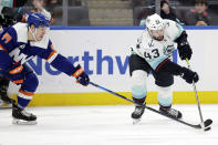 Seattle Kraken center Colin Blackwell (43) controls the puck past New York Islanders center Jean-Gabriel Pageau in the first period of an NHL hockey game Wednesday, Feb. 2, 2022, in Elmont, N.Y. (AP Photo/Adam Hunger)