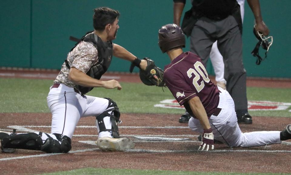 Iona Prep's Luke Nascimento tags Monsignor Farrell's Tim Manuelian who scored because of interference during the CHSAA city championship final at St. Johns June 10, 2022. Iona won 3-2.