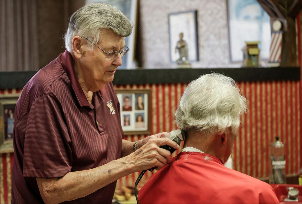 Antonie’s Barber Shop’s John Antonie cuts the hair of Phil Rodriguez, of Manitowoc, Wis.,Tuesday, August 22, 2023, in Two Rivers, Wis. Antonie will retire this month.
