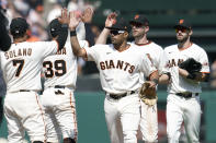 San Francisco Giants' Donovan Solano, from left, celebrates with Thairo Estrada, LaMonte Wade Jr, Austin Slater and Steven Duggar after the Giants defeated the Pittsburgh Pirates in a baseball game in San Francisco, Sunday, July 25, 2021. (AP Photo/Jeff Chiu)