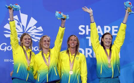 Swimming - Gold Coast 2018 Commonwealth Games - Women's 4 x 100m Freestyle Relay Final - Optus Aquatic Centre - Gold Coast, Australia - April 5, 2018. Gold medalists Shayna Jack, Bronte Campbell, Emma McKeon and Cate Campbell of Australia celebrate on the podium. REUTERS/David Gray