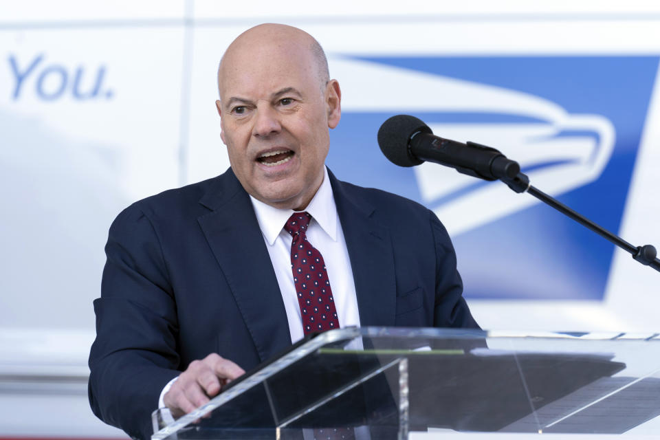 Postmaster General of the United States of America Louis DeJoy, speaks during a news conference announcing the Postal Service will sharply increase the number of electric-powered delivery trucks in its fleet and will go all-electric for new purchases starting in 2026. (AP Photo/Jose Luis Magana)