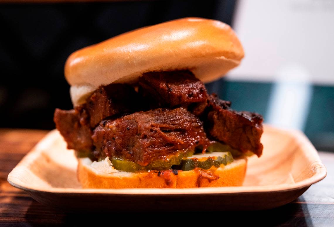 Many of the arena’s offerings feature brands based in Seattle and the greater Pacific Northwest, including Richard’s Too Good BBQ on this house-smoked brisket sandwich.