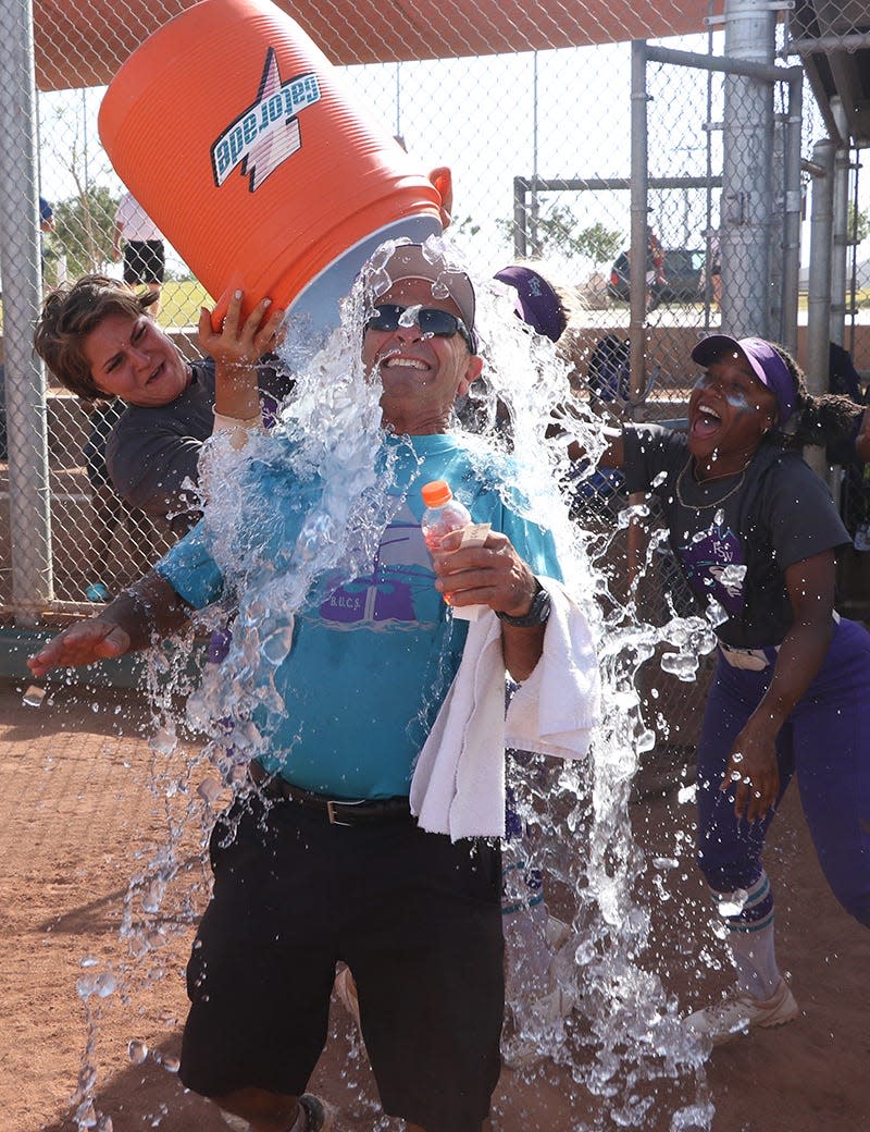 FSW softball head coach Robert Iamurri gets doused after his team won its second NJCAA national Championship.