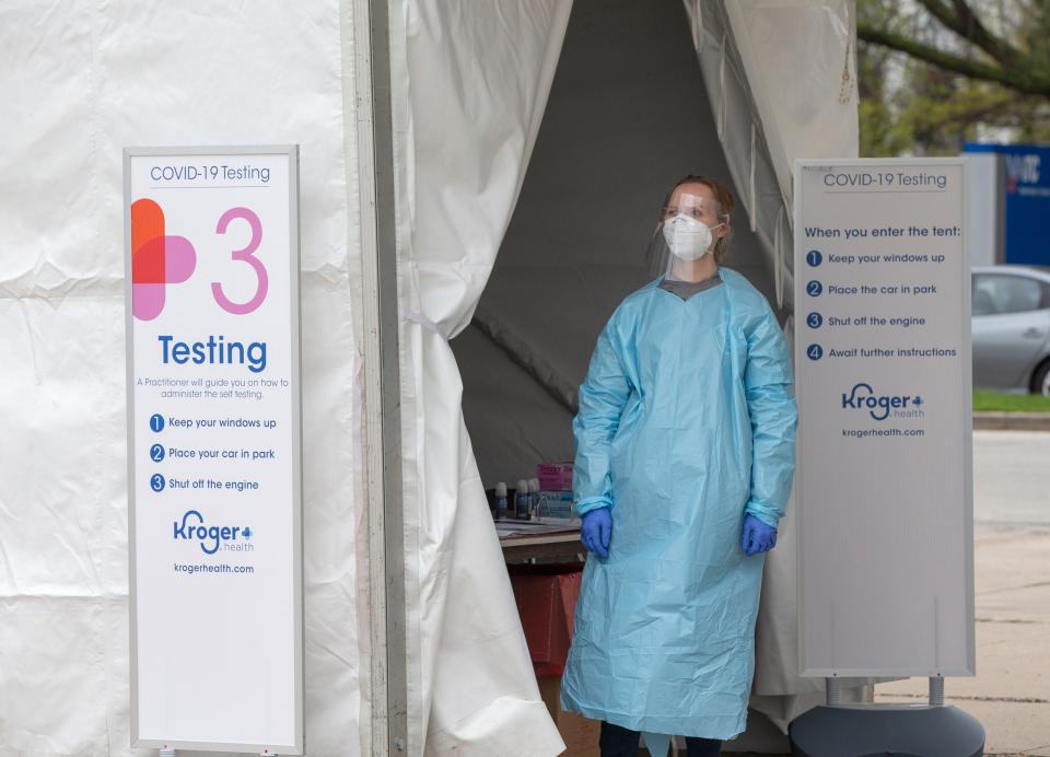 A pharmacist waits for the next person to get a COVID-19 test at the BMO Harris Bradley Center in Milwaukee.