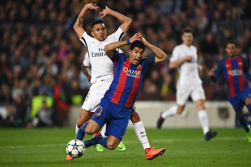 <p>Luis Suarez of Barcelona is challenged by Marquinhos of PSG for a penalty during the UEFA Champions League Round of 16 second leg match between FC Barcelona and Paris Saint-Germain at Camp Nou on March 8, 2017 in Barcelona, Spain. (Photo by Laurence Griffiths/Getty Images) </p>