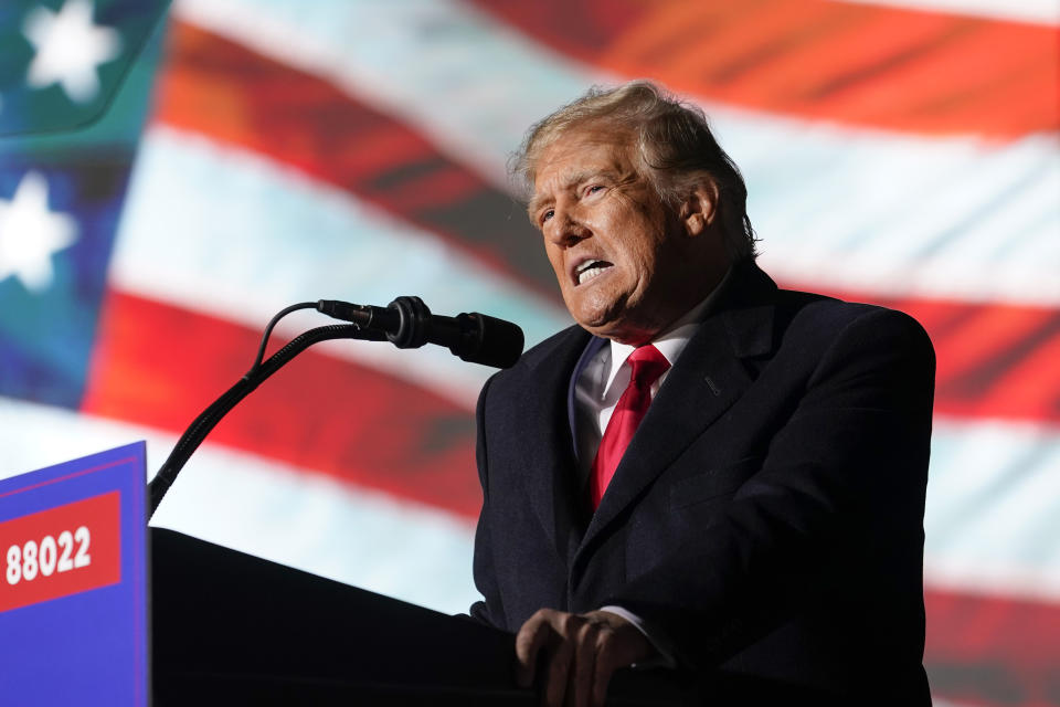 FILE - Former President Donald Trump speaks at a campaign rally in support of the campaign of Ohio Senate candidate JD Vance at Wright Bros. Aero Inc. at Dayton International Airport, Nov. 7, 2022, in Vandalia, Ohio. On Friday, March 24, 2023 The Associated Press reported on stories circulating online incorrectly claiming it is a double standard that Trump may be indicted over alleged hush money payments to women who accused him of sexual encounters, while former President Bill Clinton faced no criminal charges for paying a sexual harassment accuser $850,000. (AP Photo/Michael Conroy, File)