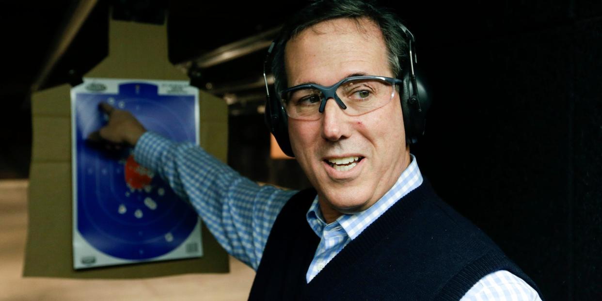 Republican presidential candidate, former Pennsylvania Sen. Rick Santorum point to his target during a campaign stop at the Central Impact Shooting Range, Saturday, Jan. 30, 2016 in Boone, Iowa.