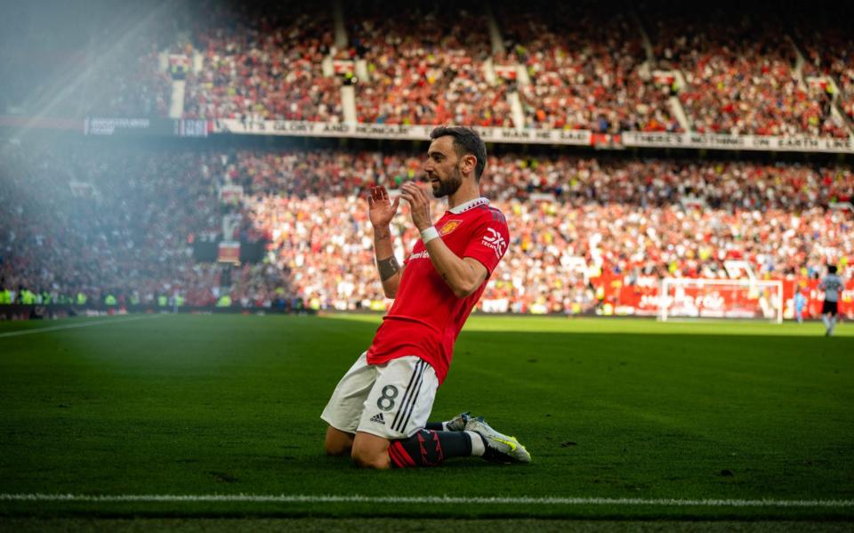 Bruno Fernandes of Manchester United celebrates scoring a goal to make the score 2-1 during the Premier League match between Manchester United and Fulham FC at Old Trafford - Getty Images/Ash Donelon