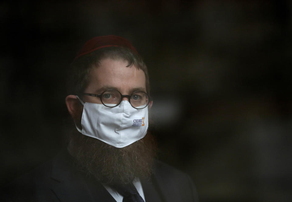 Slomo Koves, the chief rabbi of the Association of Hungarian Jewish Communities is seen in his office in Budapest, Hungary on Jan. 14, 2021. Hungarian Jewish community, exporter of Kosher meat, fear that the European Court of Justice verdict on upholding a Belgian law that banned ritual slaughter could have an affect on other EU member states' regulation on Kosher slaughter. Animal rights groups that pushed for the Flanders law argue that ritual slaughter without stunning amounts to animal cruelty. (AP Photo/Laszlo Balogh)