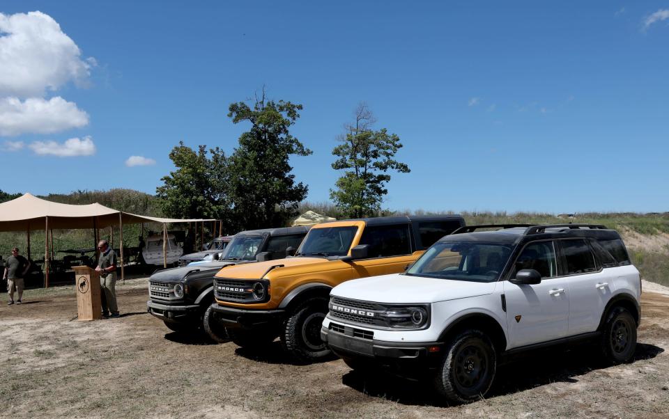 2021 Bronco four-door (left), Bronco two-door (center) and Bronco Sport (right) on display while Mark LaNeve, the Ford Motor Company vice president, U.S. Marketing, Sales and Service talked to members of the media during the 2020 Bronco Day event at the soon-to-be-opening Holly Oaks Off-road Park in Holly, Mich.Holly, Michigan on August 11, 2020.