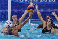 United States' Makenzie Fischer, second from left, and Rachel Fattal, right, defend against Ekaterina Prokofyeva (3), of the Russian Olympic Committee, during a semifinal round women's water polo match at the 2020 Summer Olympics, Thursday, Aug. 5, 2021, in Tokyo, Japan. (AP Photo/Mark Humphrey)