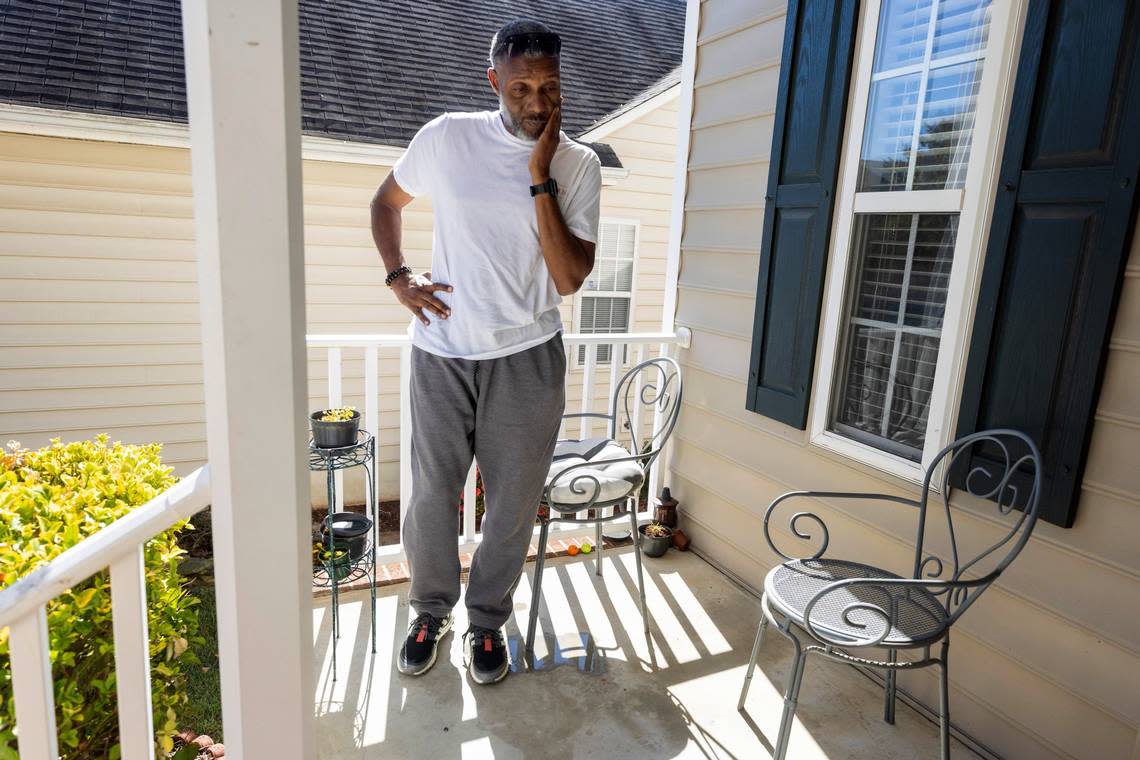 Tracey Howard stands on the porch of his home in the Hedingham neighborhood at 5355 Sahalee Way after talking with the media on Oct. 14. His wife Nicole Connors and their dog were killed on the porch a day earlier. Howard was running an errand at the time of the shooting that killed five people, including his wife and an off-duty police officer.