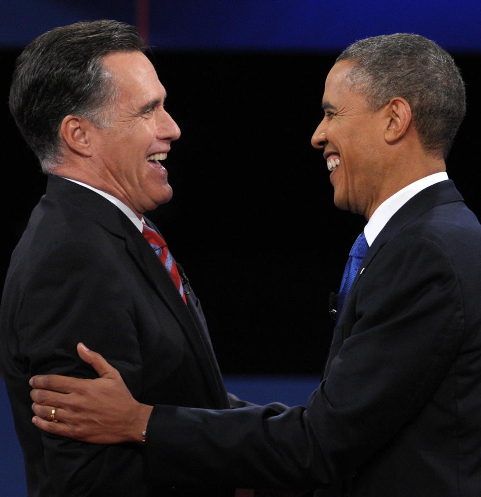 US President Barack Obama (R) greets Republican presidential candidate Mitt Romney (L) following the third and final presidential debate at Lynn University in Boca Raton, Florida, October 22, 2012. The showdown focusing on foreign policy is being held in the crucial toss-up state of Florida just 15 days before the election and promises to be among the most watched 90 minutes of the entire 2012 campaign. AFP PHOTO / Saul LOEB        (Photo credit should read SAUL LOEB/AFP/Getty Images)
