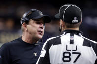 New Orleans Saints head coach Sean Payton talks to side judge Walt Coleman IV (87) in the first half of an NFL football game against the New York Giants in New Orleans, Sunday, Oct. 3, 2021. (AP Photo/Derick Hingle)