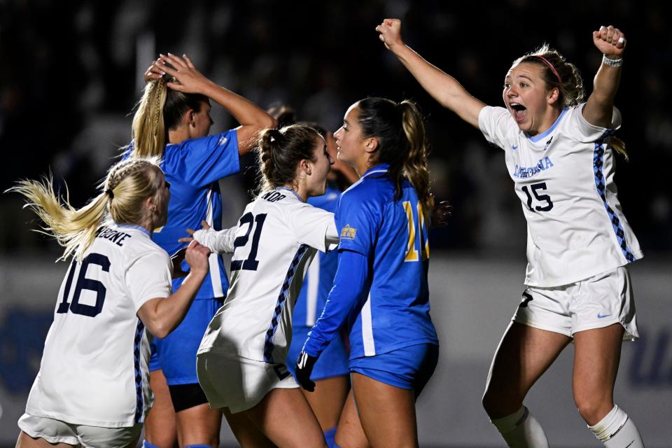 UNC's Avery Patterson (right) celebrates her second-half goal with teammates.