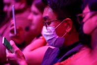 An attendee wears a surgical mask during Samsung Galaxy Unpacked 2020 in San Francisco