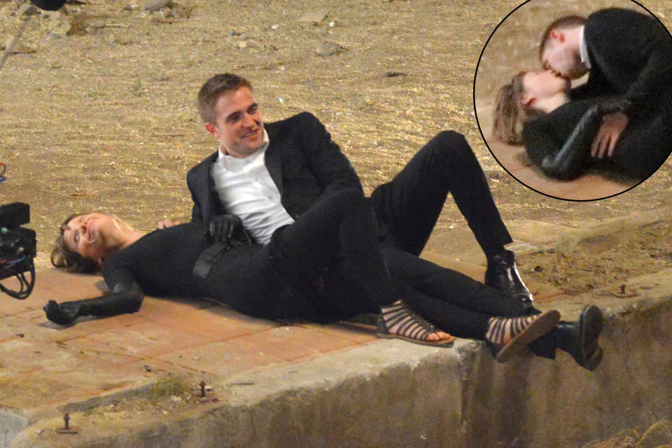 <b>The Old Smooch and Giggle</b><br> The scene calls for passion, but Robert Pattinson and co-star Mia Wasikowska can't help but laugh and smile in between takes while shooting the David Cronenberg film "Maps to the Stars" on Wednesday in Los Angeles. Pattinson plays a limo driver and aspiring actor in the 2014 thriller, described as a scathing attack on celebrity obsession. His key to shooting love scenes? "You've got to really know what you're doing," he told <a href="http://www.mtv.com/news/articles/1660277/robert-pattinson-water-for-elephants.jhtml" rel="nofollow noopener" target="_blank" data-ylk="slk:MTV News;elm:context_link;itc:0;sec:content-canvas" class="link ">MTV News</a> in 2011. "If it's just a sort of arbitrary love scene, it'd be quite difficult."