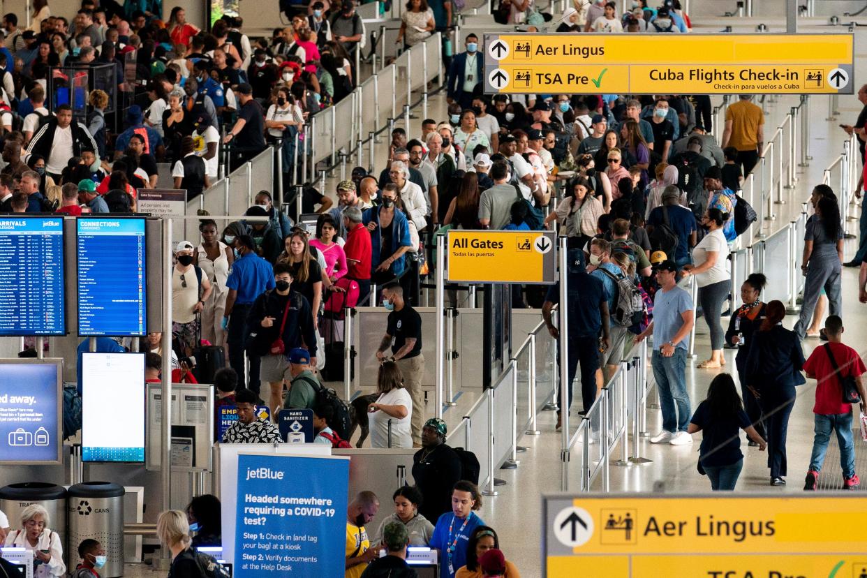 People wait in a TSA line at the John F. Kennedy International Airport on June 28, 2022, in New York. (AP Photo/Julia Nikhinson, File)