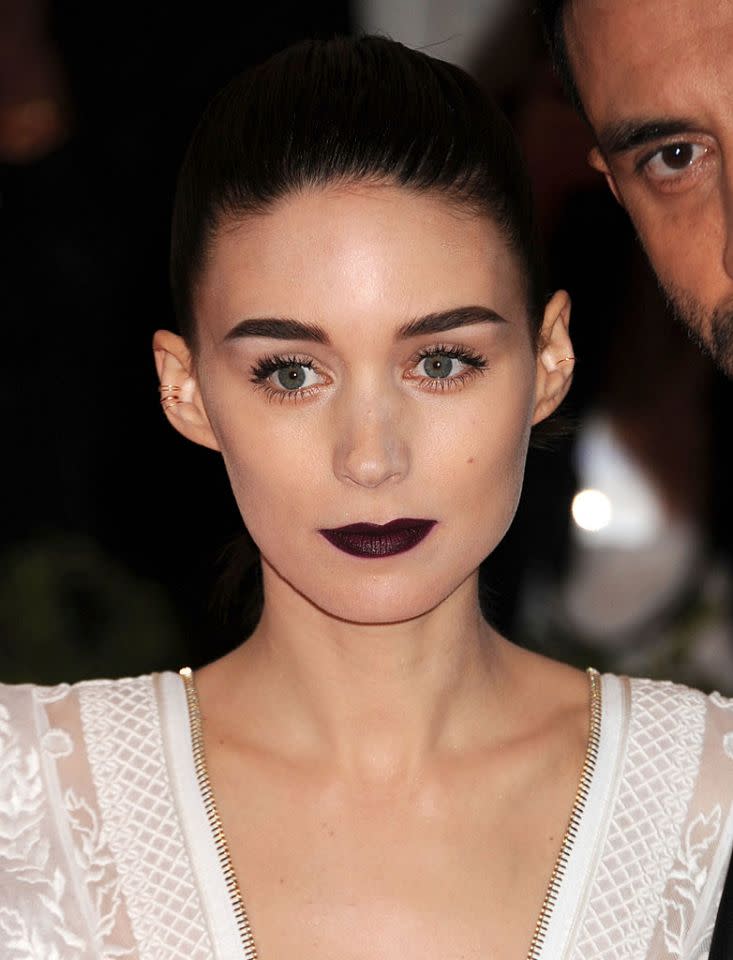 <p>Rooney Mara’s Met Gala look was dark without being gothic thanks to pinky brown blush under her cheekbones. (Photo: Getty) </p>