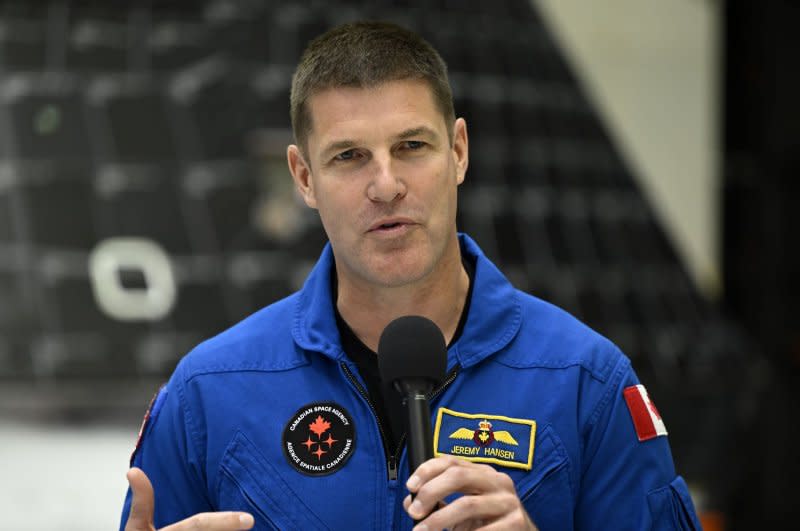 NASA's Artemis II mission specialist Jeremy Hansen from the Canadian Space Agency responds to questions from the media while visiting the Orion spacecraft Tuesday at Kennedy Space Center in Florida as it is being prepared for his mission planned for late 2024. Photo by Joe Marino/UPI