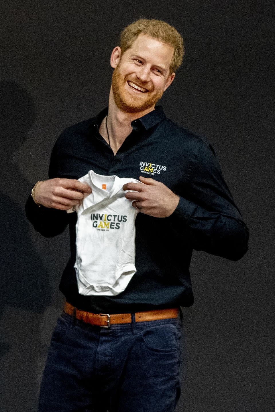 <p>During the Invictus Games launch in The Hague, Netherlands, Harry is presented with an Invictus Games outfit for baby Archie. </p>