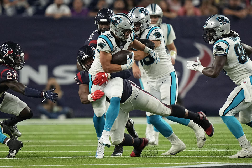 Carolina Panthers running back Christian McCaffrey (22) is tackled by Houston Texans' Paul Quessenberry during the first half of an NFL football game Thursday, Sept. 23, 2021, in Houston. (AP Photo/Eric Christian Smith)