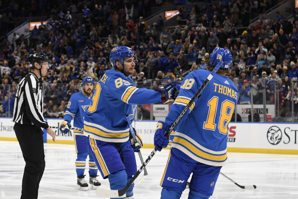 St. Louis Blues' Pavel Buchnevich (89) celebrates with Robert Thomas (18) after scoring a goal against the Anaheim Ducks during the second period of an NHL hockey game, Saturday, Nov. 19, 2022, in St. Louis. (AP Photo/Jeff Le)