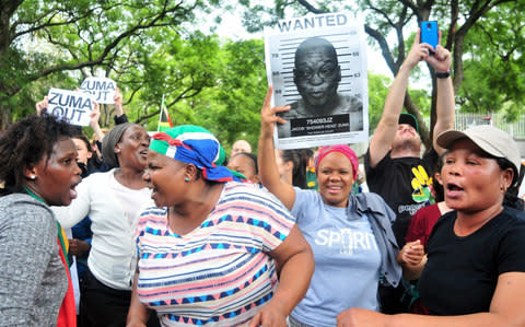 Protestors outside the Gupta's Saxonwold residence call for President Zuma to step down in April - Credit:  Gallo Images