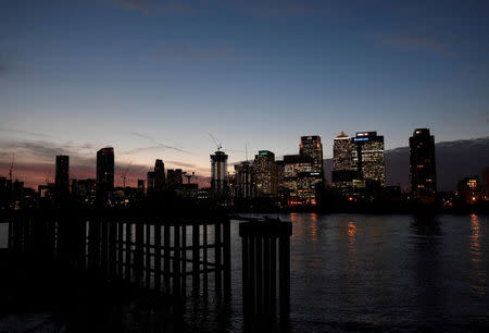 FILE PHOTO: The Canary Wharf financial district is seen at dusk in London, Britain, November 17, 2017. Picture taken November 17, 2017. REUTERS/Toby Melville/File Photo