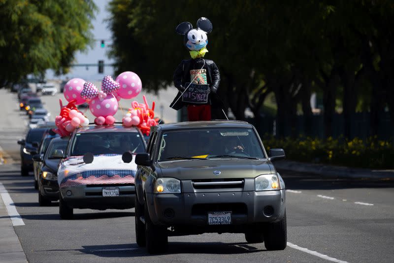 Disney cast members stage a car caravan outside Disneyland California, calling for higher safety standards for Disneyland to reopen