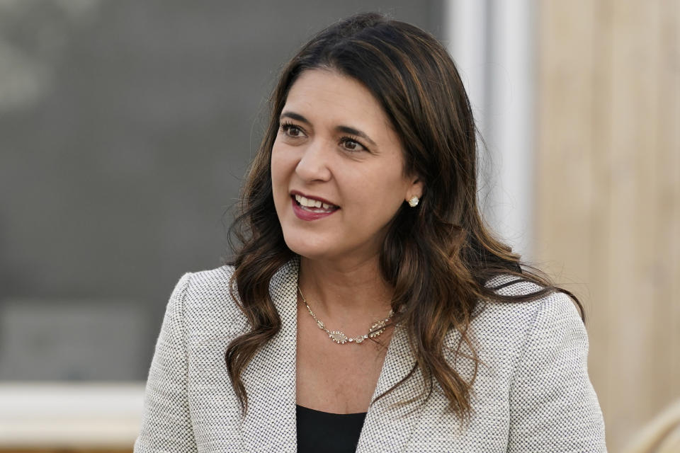 FILE - In this Wednesday, Sept. 30, 2020, file photo, Oklahoma state Sen. Stephanie Bice, Republican candidate for the U.S. House, talks with people at a meet-and-greet event in Oklahoma City. U.S. Rep. Kendra Horn pulled off one of the biggest political upsets in 2018 when she ousted a two-term Republican incumbent. But Horn won't have the element of surprise in this year's contest against Bice. (AP Photo/Sue Ogrocki, File)