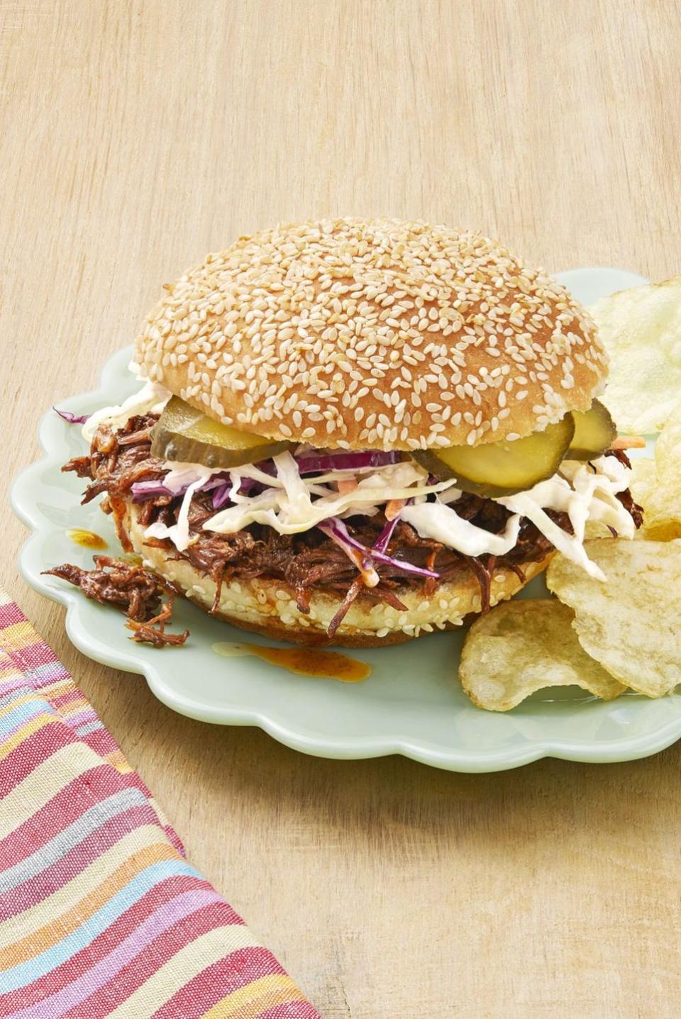 instant pot bbq beef sandwiches on plate with chips