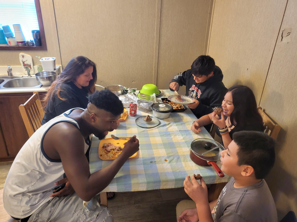 Elena Paredes and her family celebrate Thanksgiving at her brother's FEMA Trailer in Ashland, November 27. From left to right: Elena Paredes, T.J. Huckaby, Pedro Paredes, Cheralynn Lopez, and Cruzito Paredes.