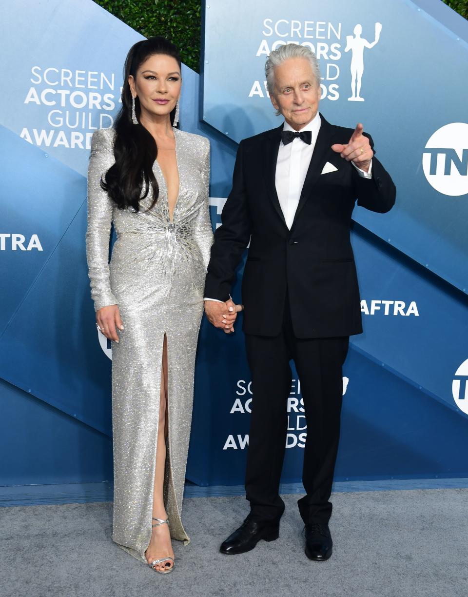 US actor Michael Douglas and his wife actress Catherine Zeta-Jones arrive for the 26th Annual Screen Actors Guild Awards at the Shrine Auditorium in Los Angeles on January 19, 2020. (Photo by FREDERIC J. BROWN / AFP) (Photo by FREDERIC J. BROWN/AFP via Getty Images)